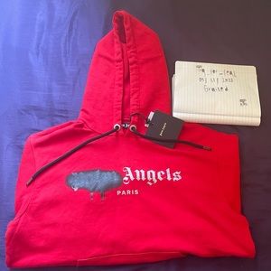 PALM ANGELS SPRAYED PAINT HOODIE.